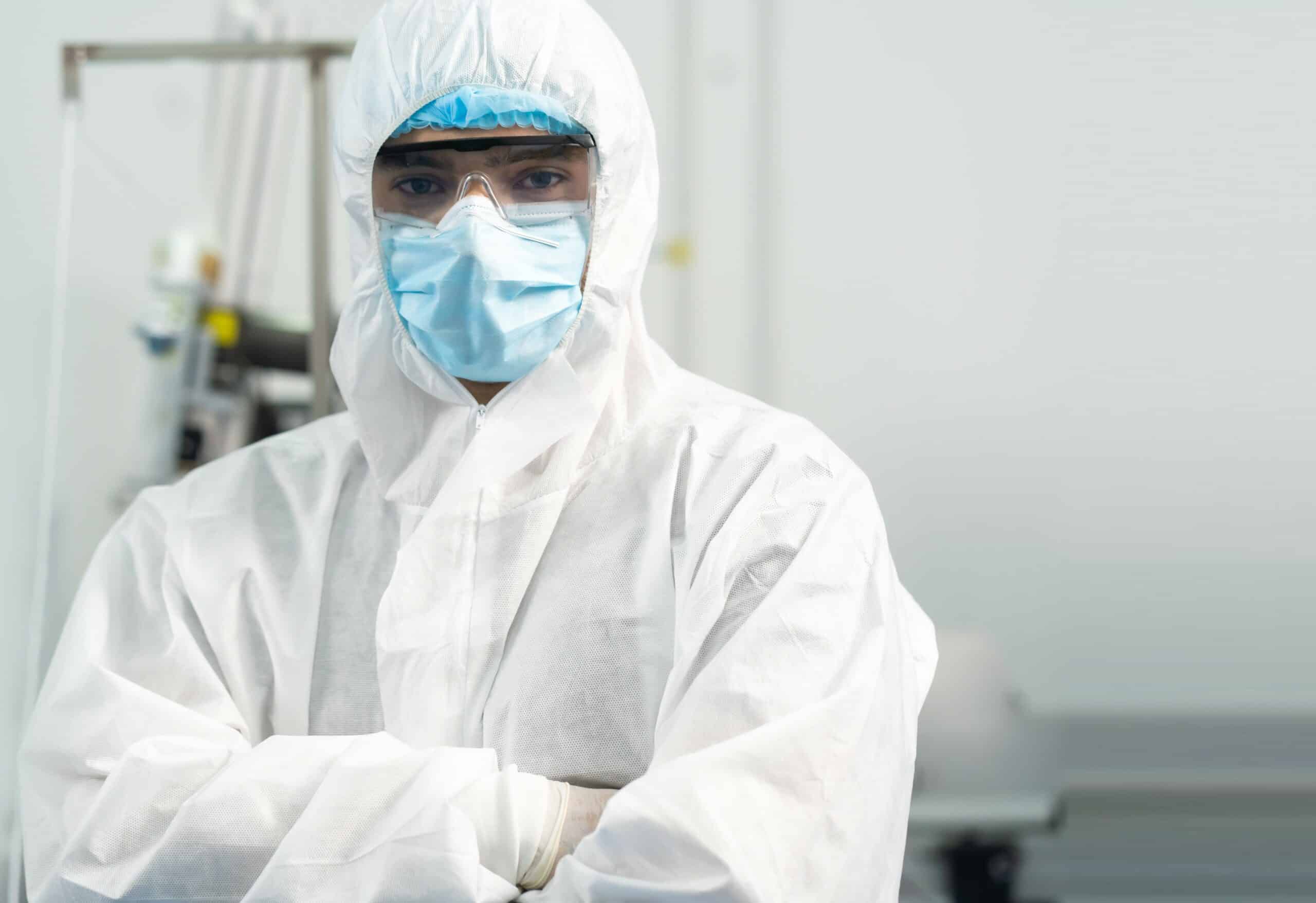 Professional engineering man in sterile cloths and face mask in surgical mask